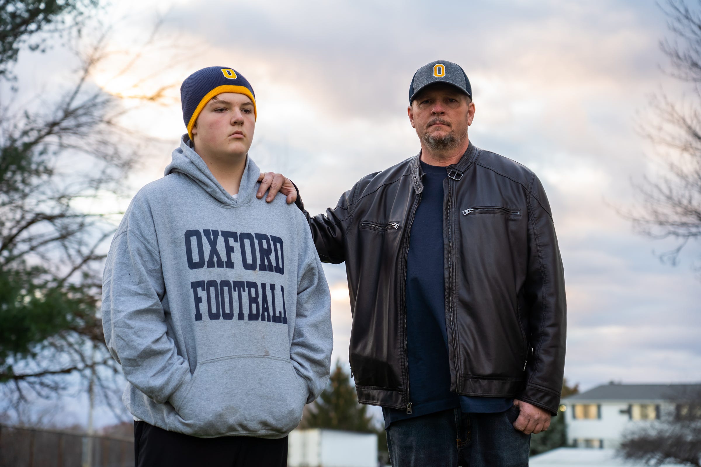 Stephen Cumbey, of Oxford, stands with his son, Nolan Cumbey, who was in school with his brother at Oxford High School during the shooting in which four students were killed after a classmate opened fire injuring multiple others.