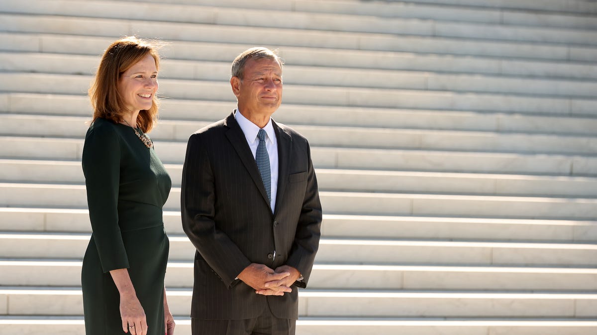 Supreme Court Associate Justice Amy Coney Barrett and Chief Justice John Roberts at the Supreme Court on October 01, 2021.