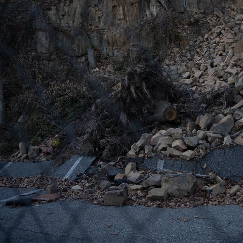 A landslide caused by Hurricane Ida sits behind an