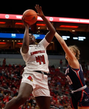 Louisville’s Olivia Cochran goes up for two against Belmont’s Conley Chinn.Dec. 5, 2021