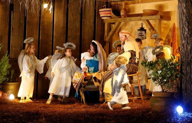 Volunteers portray the birth of Christ in a live Nativity pageant at 904 Princeton Place in Northport in this file photo. The pageant will be be held Dec. 19-26 with two shows each evening at 7 p.m. and 7:45 p.m. Admission is free. [Staff Photo/Gary Cosby Jr.]