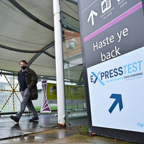 Passengers are seen at Edinburgh airport as the UK