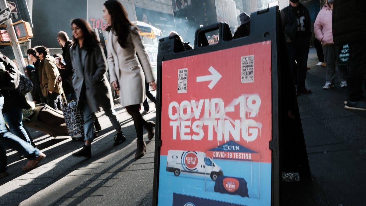 Coronavirus testing is available in Times Square in New York City. After the discovery of the omicron variant, health officials urge people to get vaccine boosters.
