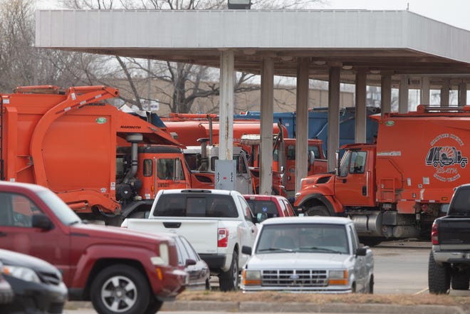 Lines of Shawnee County Solid Waste trucks dock Tuesday at the Shawnee County Refuse Department, 1515 N.W. Saline St. #150. Due to labor shortages, 90% of recycled material entering this location is trucked out to other facilities.