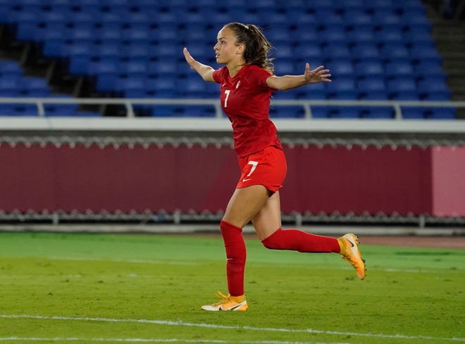 Canada's Julia Grosso celebrates after netting the winning penalty kick to defeat Sweden during the women's final soccer match at the Tokyo Summer Olympics. Grosso, a senior midfielder for Texas, has signed with Juventus F.C. Women.
