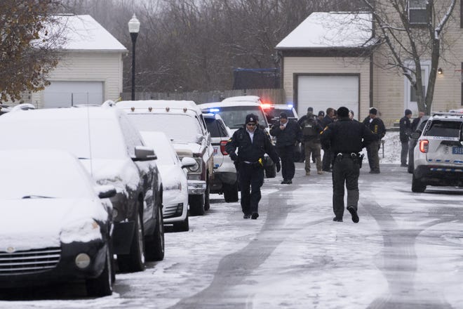 Area law enforcement personnel and medics at the scene on Dec. 8 on the 2700 block of Four Seasons Drive on the Southeast Side after gunfire erupted while the federal SOFAST task force was serving an arrest warrant. A deputy U.S. marshal was shot by a gunman hiding in a closet and the gunman was killed in an exchange of gunfire, according to the Franklin County Sheriff's office, which is investigating the incident.