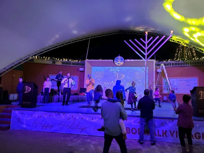 Chabad of the Emerald Coast provides the giant Menorah, the music and entertainment and lots of food.