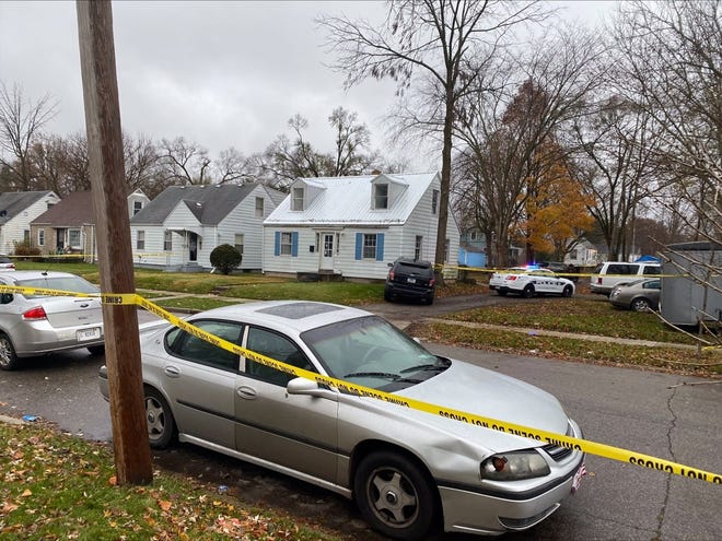 South Bend police set up crime scene tape at the scene of a fatal shooting near North Kaley Street and Elwood Avenue on Nov. 25, 2021.