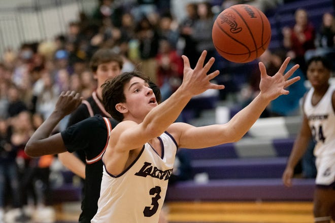 Lakeview senior Hayden Mueller (3) catches the rebound on Tuesday, Dec. 7, 2021, at Lakeview High School in Battle Creek, Michigan.