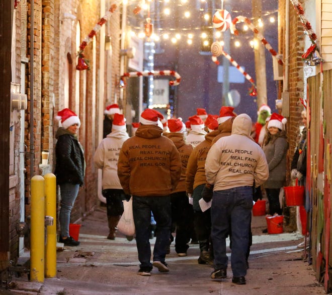 Christmas carolers make their way through Richmond's Christmas in the Depot Dec. 7, 2021.