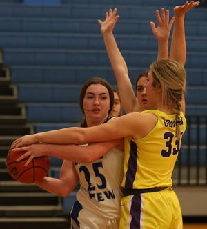 Lake View's Mikaila Wagner, 25, tries to maintain possession of the ball as Ozona's Claire Bean, 33, and a teammate make things difficult at Ben Norton gym on Tuesday, Dec. 7, 2021.