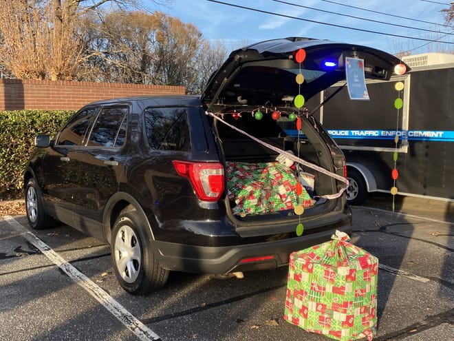 Gastonia Police officers buy gifts for the children of the Boys and Girls Clubs of Gaston for Shop with a Cop Thursday, Dec. 9.