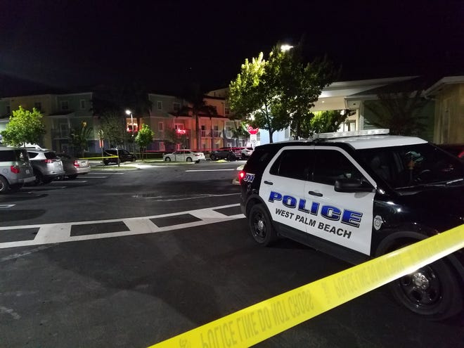 West Palm Beach police investigate a fatal shooting at the Dunbar Village apartment complex on Wednesday, Dec. 8, 2021. [Photo by West Palm Beach Police Department]