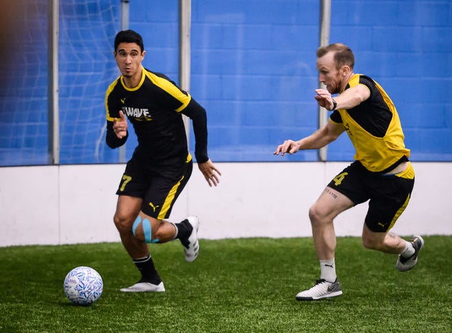 Marcio Leite looks to pass the ball while defended by Alex Bradley during Milwaukee Wave practice Wednesday at the Brookfield Sports Complex.