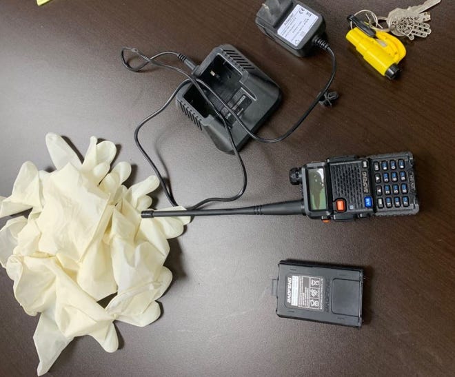 Detectives report they found burglary tools when they searched a vehicle: rubber gloves, a window punch, and two-way radio/police scanner. They arrested two men on Dec. 8, 2021.