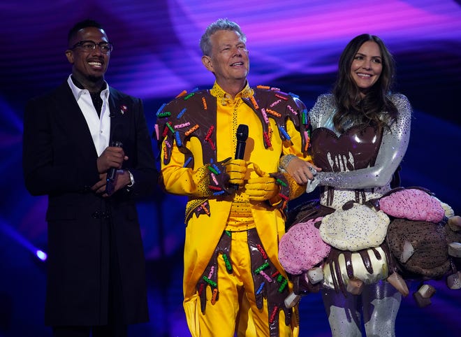 (L-R) Host Nick Cannon, David Foster and Katharine McPhee on "The Masked Singer."