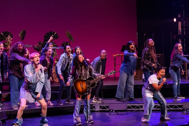 Members of the Boston Children's Chorus back up main cast members from left, Luke Ferrari, YDE and Paravi Das in a concert version of the in-development "Wild, a Musical Becoming" at American Repertory Theater.