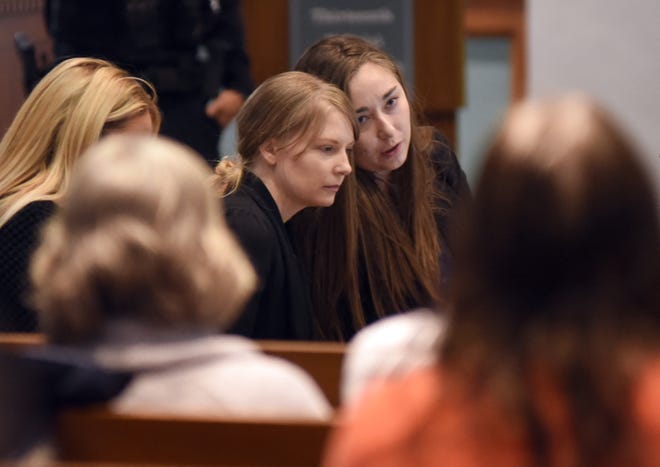 Lynlee Renick, center, listens to defense attorney Katherine Berger on Dec. 6 at the Boone County Courthouse. Renick last month was convicted of second-degree murder and armed criminal action in the death of her snake-breeder husband.