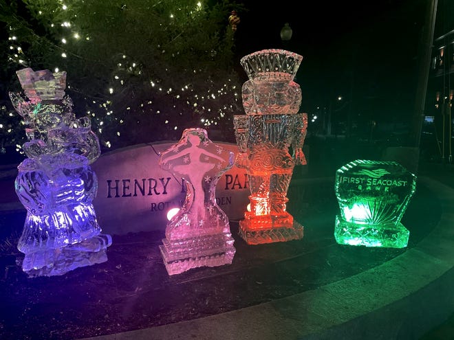 Ice sculptures in "The Nutcracker" theme are seen near the Dover city Christmas tree at Henry Law Park.