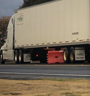 A barrier dislodged by a truck near Hansen Road. Residents say the rural two-lane road attracts hundreds of cars and trucks per day, many speeding to and from the nearby Prologis warehouse project.