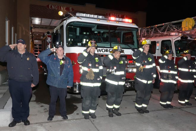 Worcester firefighters salute during a third anniversary remembrance ceremony for fallen Firefighter Christopher Roy at Webster Square Fire Station on Thursday night.