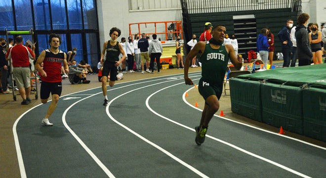 South Hagerstown's Cole Schlotterbeck leads Linganore's Aaron Dufresne and Century's Ryan Sien on the final turn of the boys 300 during the Terry Baker Invitational indoor track and field meet Friday at Hagerstown Community College. Schlotterbeck won in 37.73 seconds, and teammate Jacob Stoner placed second in 38.94.