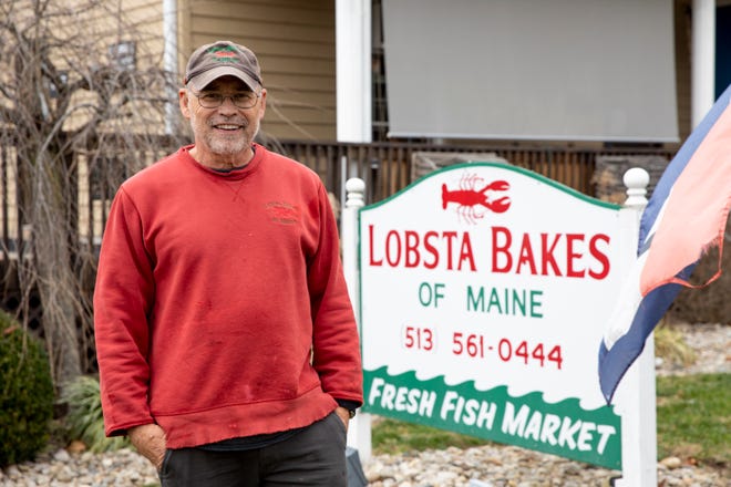 Kevin Smith, Lobsta Bakes of Maine Fresh Seafood Market and Catering owner, stands outside his store on Friday, Dec. 10, 2021, in Newtown, Ohio. After announcing his retirement last month, he's found new owners for the market.