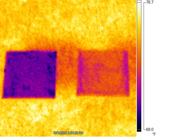 An infrared camera image shows that white radiative cooling paint developed by Purdue University researchers (left, purple) can stay cooler in direct sunlight compared with commercial white paint.
