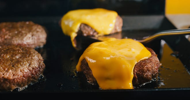 Pictured: Soy-based burger patties from Impossible Foods. In 2021 the company launched fast food, ghost kitchen restaurants in Arizona.