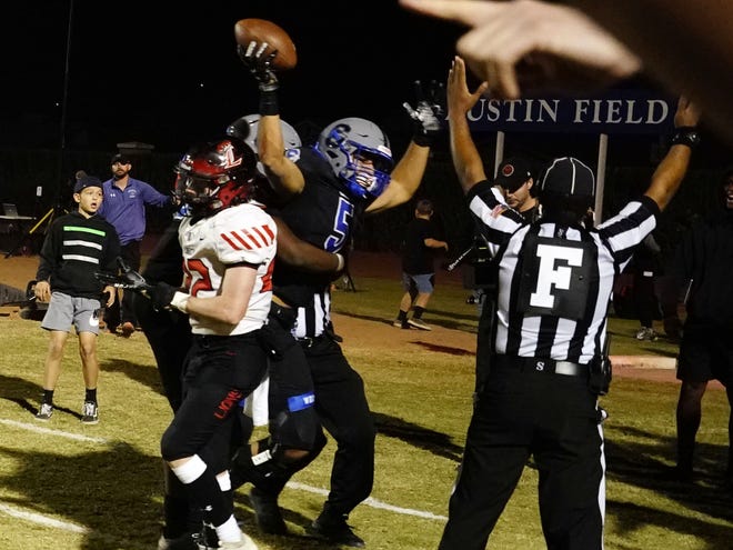 ChandlerÕs Nason Coleman (5) celebrates his touchdown in  against Liberty during their Open division semi-final playoff game in Chandler Dec, 4, 2021.