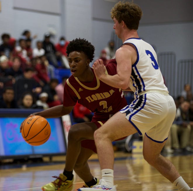 Junior guard Anthony Robinson Jr. (2) dribbles past a Maclay player in a game against Maclay on Dec. 9, 2021, at Maclay School. The Seminoles defeated the Marauders, 78-59.