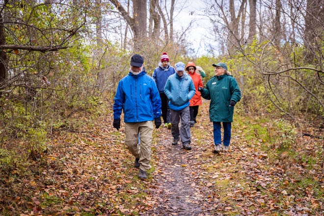 White Clay Creek Park Superintendent Laura Lee, right, leads a hike earlier this year. Guided hikes are offered in the winter at many Delaware State Parks, and the park staffs encourage visitors to take a self-guided "First Day" hike Jan. 1 at any state park to start the 2022 on the right foot.