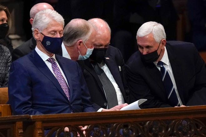 President Bill Clinton seated in a pew just in front of former Vice Presidents Dan Quayle, Dick Cheney and Mike Pence at the funeral service of former Sen. Bob Dole at the Washington National Cathedral in Washington D.C.