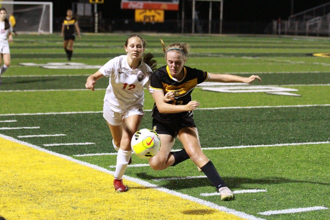 St. Amant’s Kendal Waguespack (right) battles for the ball during the Lady Gators’ loss to Fontainebleau.