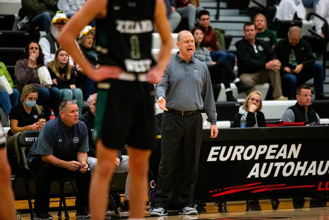 West Ottawa head coach Steve Windemuller calls out to his players during a game agaisnt Zeeland West Friday, Dec. 10, 2021, at West Ottawa High School. 