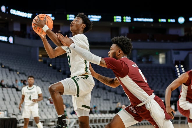 Colorado State guard Kendle Moore (3) goes up for a lay-up over Mississippi State's Rocket Watts (0) during the Hall of Fame Classic basketball game at Dickies Arena in Fort Worth, Texas.