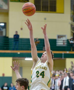 CMR's Rogan Barnwell attempts a jump shot during Friday night's basketball game against Glacier.