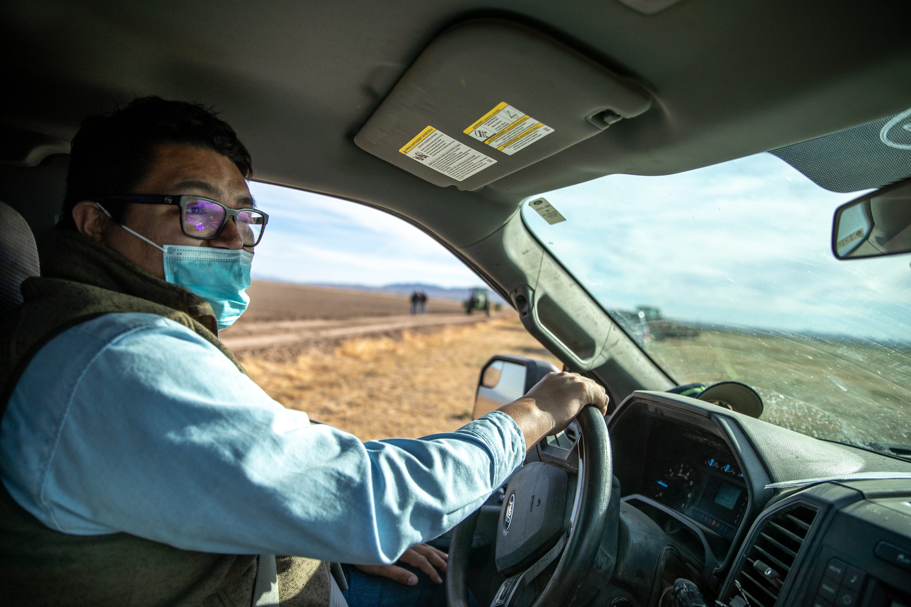 Joshua Moore, farm manager at Colorado River Indian Tribes Farms, drives through the farm's land in Parker on Dec. 10, 2021.