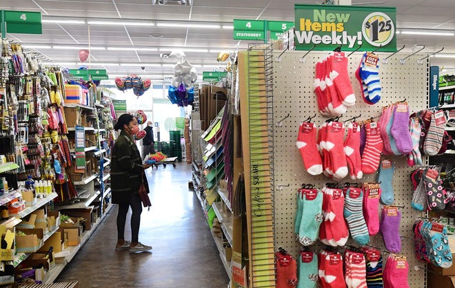 A shopper browses items in a Dollar Tree store in Alhambra, Calif. Known for its $1 items, price tags have increased to $1.25.