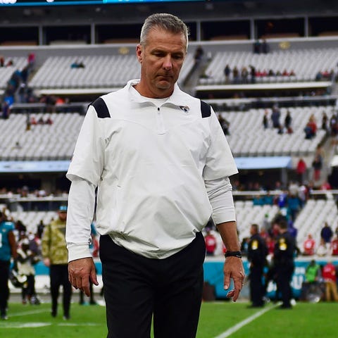 Urban Meyer walks off the field after a loss to At