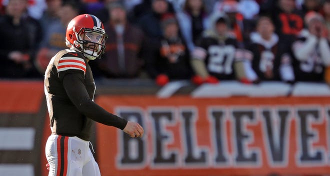 Cleveland Browns quarterback Baker Mayfield (6) walks off the field following an interception during the first half of an NFL football game against the Baltimore Ravens at FirstEnergy Stadium, Sunday, Dec. 12, 2021, in Cleveland, Ohio. [Jeff Lange/Beacon Journal]