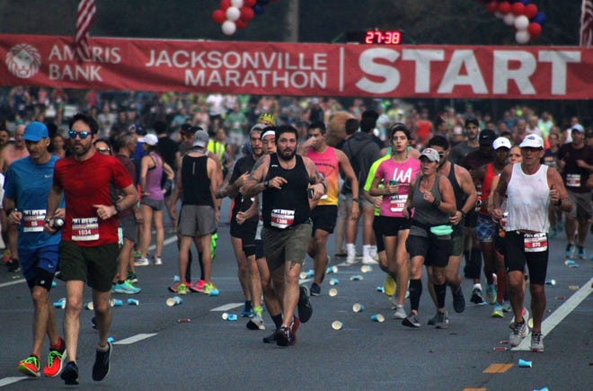 Runners race down San Jose Boulevard during the Ameris Bank Jacksonville Marathon on December 12, 2021. [Clayton Freeman/Florida Times-Union]