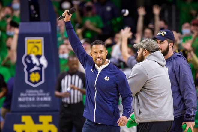 New Notre Dame head football coach Marcus Freeman is recognized on the court during a timeout in a college basketball game between ND and Kentucky on Saturday, Dec. 11, 2021, in South Bend.