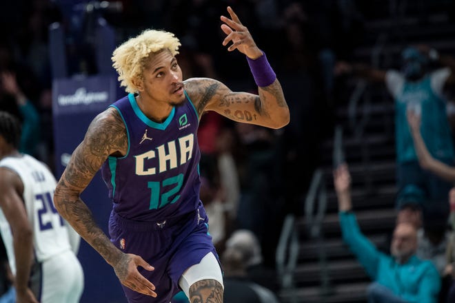 Charlotte Hornets guard Kelly Oubre Jr. (12) celebrates making a three point basket during the second half of an NBA basketball game against the Sacramento Kings, Friday, Dec. 10, 2021, in Charlotte, N.C.
