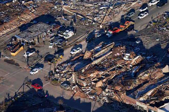 In this aerial photo, destruction from a recent tornado is seen in downtown Mayfield, Ky., Sunday, Dec. 12, 2021.