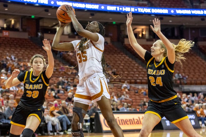 Texas forward Latasha Lattimore (35) looks to score between Idaho's Jordan Allred (30) and Tiana Johnson (24) in Austin on Dec. 11, 2021. The Longhorns were ranked 11th in the Associated Press' poll this week.