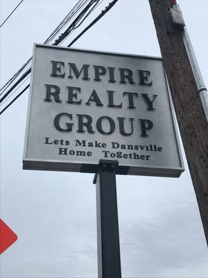 Empire Realty Group's new "Let's Make Dansville Home Together" sign was made possible through a grant program to enhance Livingston County's downtown districts.