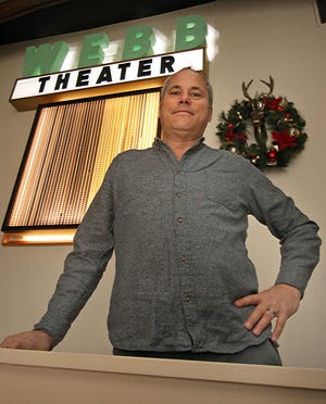 Owner Jim Morasso poses under the original Webb Theater letters inside Webb Custom Kitchen on South Street in Gastonia Monday afternoon, Dec. 13, 2021.