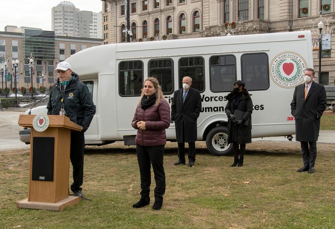 A mobile vaccination clinic van is unveiled during a COVID-19 update press conference on Worcester Common Dec. 10.