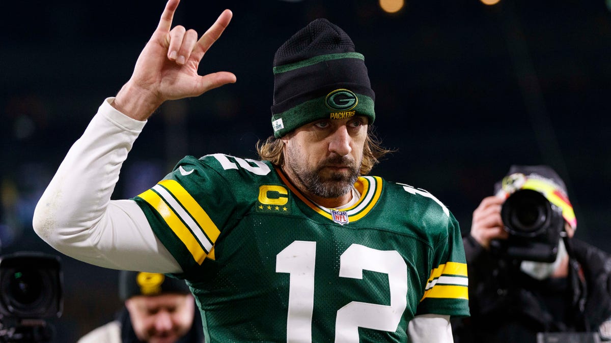 Green Bay Packers quarterback Aaron Rodgers (12) celebrates as he walks off the field following the game against the Chicago Bears at Lambeau Field.